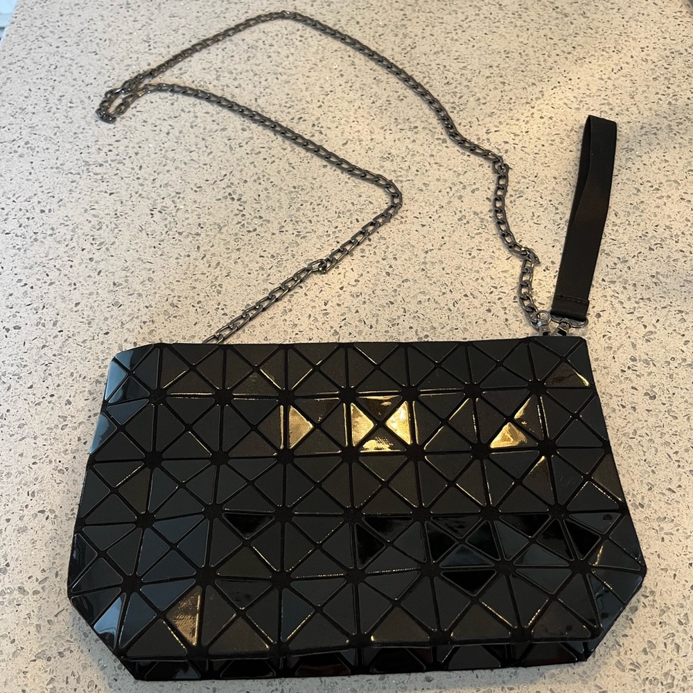 BAOBAO Issey Miyake black patent purse with gunmetal, removable chain strap.